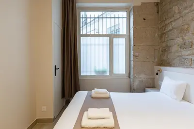 Un ou plusieurs lits dans un hébergement de l'établissement Modern duplex 10 min from Place de la Nation