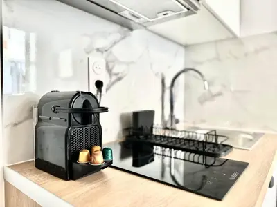 Cuisine ou kitchenette dans l'établissement New 144 Suite Falk - Cosy Apartment Paris Center