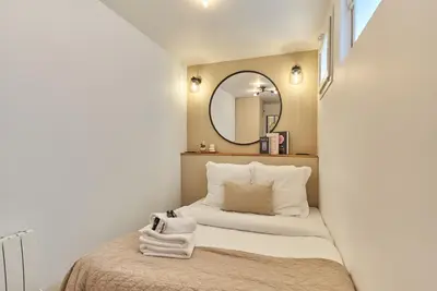 Un ou plusieurs lits dans un hébergement de l'établissement Charming Apartment - Paris Pere Lachaise