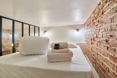 Un ou plusieurs lits dans un hébergement de l'établissement Charming Apartment - Paris Pere Lachaise