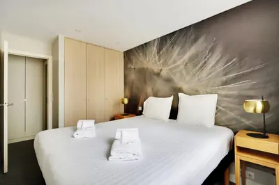 Un ou plusieurs lits dans un hébergement de l'établissement Appartement cosy - Porte de Versailles