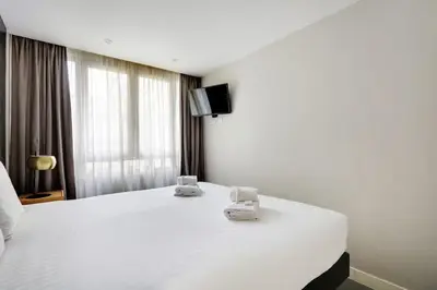 Un ou plusieurs lits dans un hébergement de l'établissement Appartement cosy - Porte de Versailles