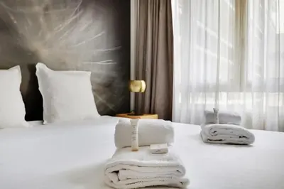 Un ou plusieurs lits dans un hébergement de l'établissement Appartement cosy - Porte de Versailles