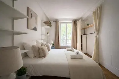 Un ou plusieurs lits dans un hébergement de l'établissement Spacieux appartement de 2 pièces à Montmartre