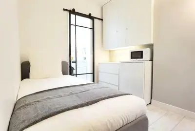 Un ou plusieurs lits dans un hébergement de l'établissement Cozy Single Flat in Paris 16th District Elevator N16-142