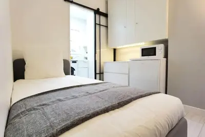 Un ou plusieurs lits dans un hébergement de l'établissement Cozy Single Flat in Paris 16th District Elevator N16-142