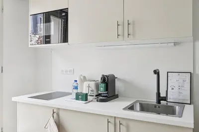 Cuisine ou kitchenette dans l'établissement Lavie Maison Spacious Studio near Montmartre