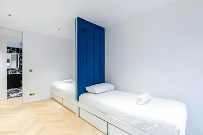 Un ou plusieurs lits dans un hébergement de l'établissement GuestReady - Spacious apt for 5 in mid-term renting