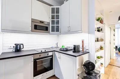 Cuisine ou kitchenette dans l'établissement GuestReady - Comfortable 2 rooms apt for 4 people