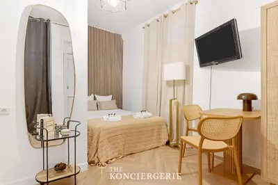 Un ou plusieurs lits dans un hébergement de l'établissement Elegant studio dans le Marais