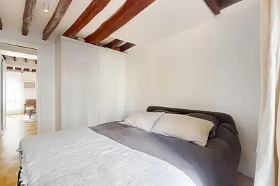 Un ou plusieurs lits dans un hébergement de l'établissement Cosy apartment - Eiffel Tower