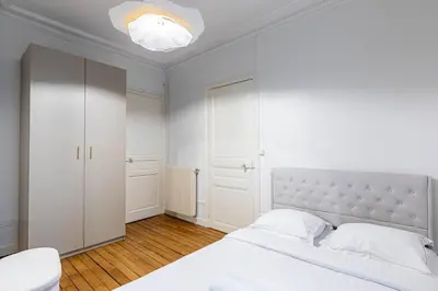 Un ou plusieurs lits dans un hébergement de l'établissement GuestReady - Charm & comfort near Parc des Princes