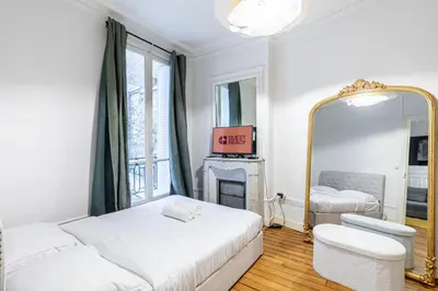 Un ou plusieurs lits dans un hébergement de l'établissement GuestReady - Charm & comfort near Parc des Princes