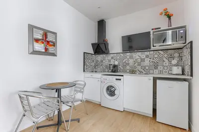 Cuisine ou kitchenette dans l'établissement Cosy Studio Cité Pilleux
