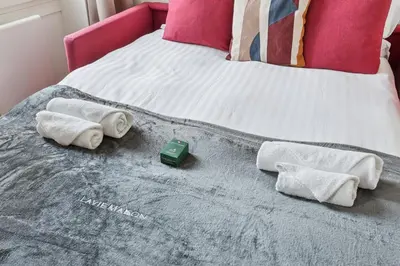 Un ou plusieurs lits dans un hébergement de l'établissement Lavie Maison Charmant Studio proche Montmartre