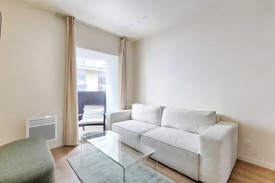 Coin salon dans l'établissement Appartement de charme au coeur d'Alesia