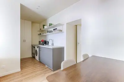 Cuisine ou kitchenette dans l'établissement Appartement de charme au coeur d'Alesia