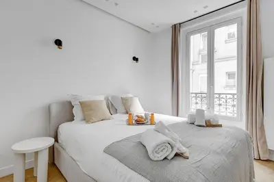Un ou plusieurs lits dans un hébergement de l'établissement 520 Suite Débarcadère - Lovely Apt Paris 17th