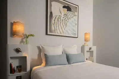 Un ou plusieurs lits dans un hébergement de l'établissement Notre Dame Paris Suite