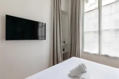 Télévision ou salle de divertissement dans l'établissement Collection Molière - appartements
