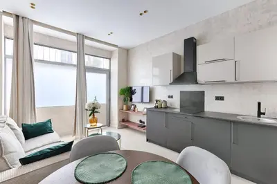 Cuisine ou kitchenette dans l'établissement Appartement de charme Belfort