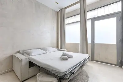 Un ou plusieurs lits dans un hébergement de l'établissement Appartement de charme Belfort