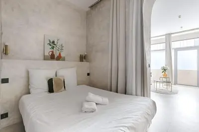 Un ou plusieurs lits dans un hébergement de l'établissement Appartement de charme Belfort