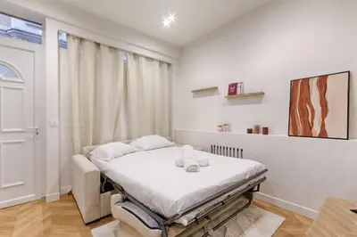 Un ou plusieurs lits dans un hébergement de l'établissement Studio Cosy Cambodge