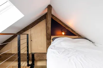 Un ou plusieurs lits dans un hébergement de l'établissement Le Saint Claude - Studio dans le Marais