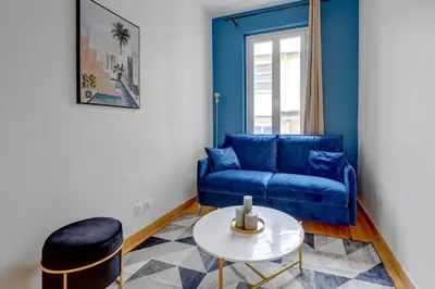 Coin salon dans l'établissement BnBNova - 2BR - Le Marais & Montorgueil