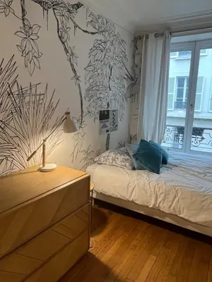 Un ou plusieurs lits dans un hébergement de l'établissement Eiffel Tower 4P apartment - Passy - quiet -