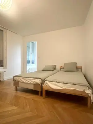 Un ou plusieurs lits dans un hébergement de l'établissement Lovely Apartment near Paris Opera & Lafayette