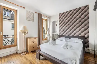 Un ou plusieurs lits dans un hébergement de l'établissement Rosiers - Magnifique appartement au centre du Marais