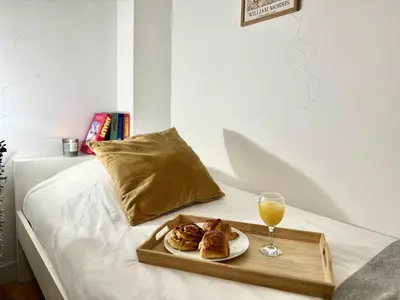 Un ou plusieurs lits dans un hébergement de l'établissement 346 New Suite Niagara - Cosy Apartment Paris Center