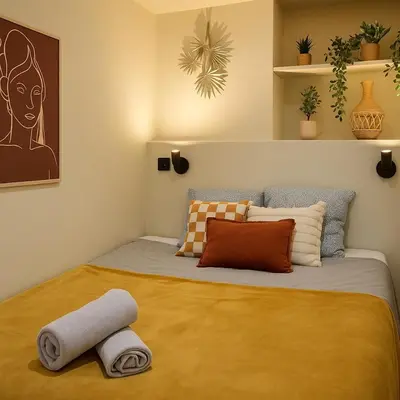 Un ou plusieurs lits dans un hébergement de l'établissement CasaHome - Cozy apartment in central Paris
