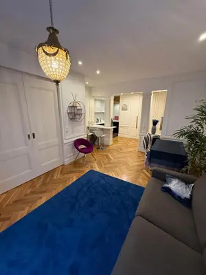 Coin salon dans l'établissement Standing Apartment - Champs Élysée
