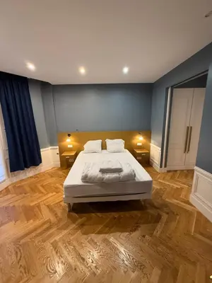 Un ou plusieurs lits dans un hébergement de l'établissement Standing Apartment - Champs Élysée