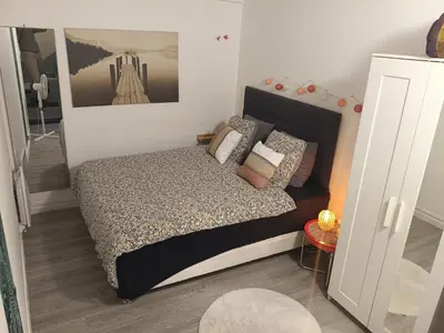 Un ou plusieurs lits dans un hébergement de l'établissement Appartement cosy proche Paris