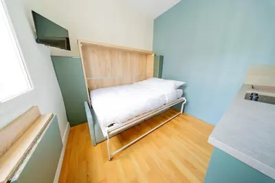 Un ou plusieurs lits dans un hébergement de l'établissement Cute Green Studio - Sebastopol