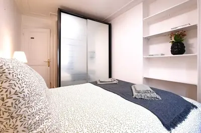 Un ou plusieurs lits dans un hébergement de l'établissement 6 Guests Flat Champs Elysees 2 BDR