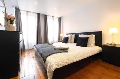 Un ou plusieurs lits dans un hébergement de l'établissement 6 Guests Flat Champs Elysees 2 BDR
