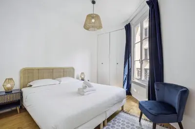 Un ou plusieurs lits dans un hébergement de l'établissement BnBNova - 1BR - Eiffel Tower & Trocadero