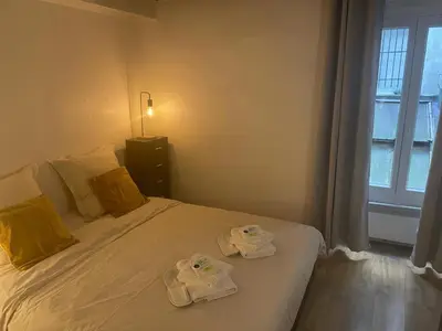 Un ou plusieurs lits dans un hébergement de l'établissement Practical 1-BR apartment next to Le Bon Marché