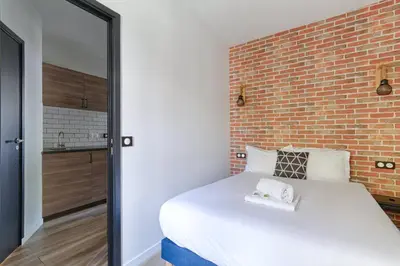 Un ou plusieurs lits dans un hébergement de l'établissement Appartement proche de Porte d'orléans