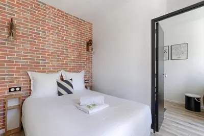 Un ou plusieurs lits dans un hébergement de l'établissement Appartement proche de Porte d'orléans