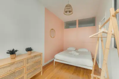 Un ou plusieurs lits dans un hébergement de l'établissement Charmant appartement 2 pièces, accès rapide Paris