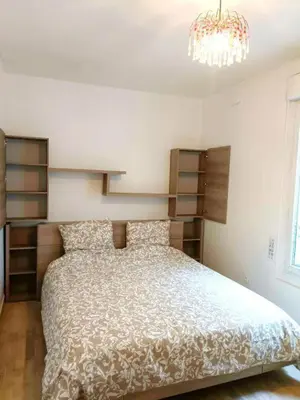 Un ou plusieurs lits dans un hébergement de l'établissement Cozy Parisian Apartment