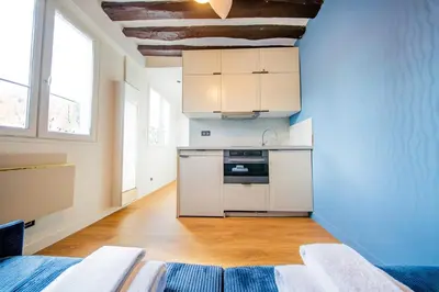 Cuisine ou kitchenette dans l'établissement Cute Blue Studio - Arts & Metiers
