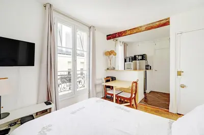 Un ou plusieurs lits dans un hébergement de l'établissement Tour Eiffel - Rue Cler