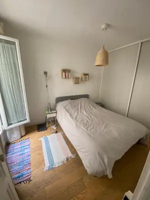 Un ou plusieurs lits dans un hébergement de l'établissement Quiet 2-room apartment in Paris